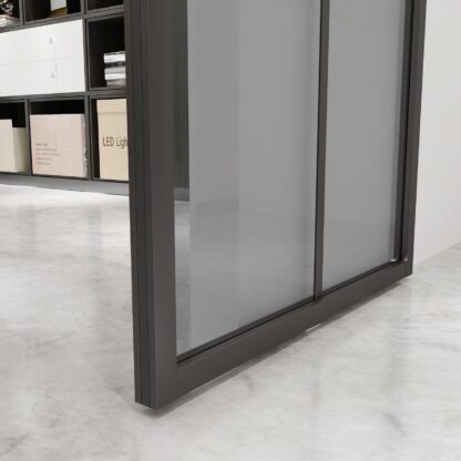 View of lower part of a Crittall style sliding glass door with pelmet