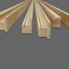 Five unfinished wooden mouldings with various profiles are displayed on grey, showing cross-sections and shapes ideal for ECLISSE Pocket Door System - Classic Double Fire-Rated installations.