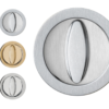 Four AURA round lock sets for sliding pocket doors in brushed metal (brass, matt silver, shiny silver) are arranged vertically on a white background. The largest lock set features a shiny silver finish.