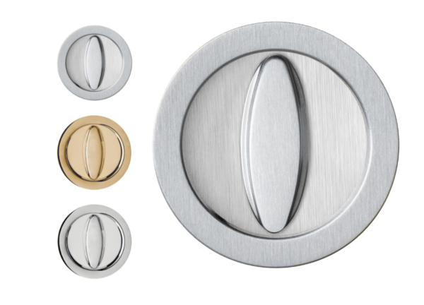 Four AURA round lock sets for sliding pocket doors in brushed metal (brass, matt silver, shiny silver) are arranged vertically on a white background. The largest lock set features a shiny silver finish.