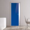 A modern, minimal room with light wood floors showcases a bright blue ECLISSE Pocket Door System (Classic Single Glass Doors 10mm). The space features white walls, a matching dining set, a sideboard, and two brown decorative vases.