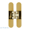 A gold concealed door hinge is centred on a white background, highlighting the Rocket Door Frames - ULTRA Flush Hinged product, with the Rocket Door Frames logo and text in the bottom left corner.