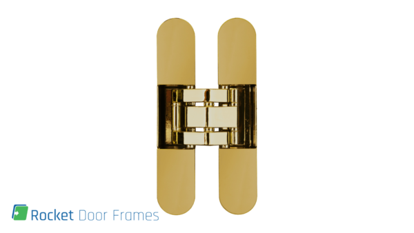 A gold concealed door hinge is centred on a white background, highlighting the Rocket Door Frames - ULTRA Flush Hinged product, with the Rocket Door Frames logo and text in the bottom left corner.