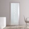 A modern interior with ECLISSE Pocket Door Systems - Classic Single Glass Doors featuring a frosted zigzag pattern, white walls, light wood floors, a sleek white cupboard with tall vases, and a dining table set by a large window.