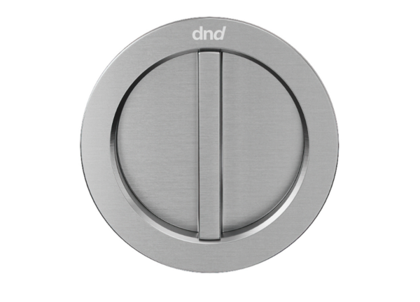 The CASSIOPEIA Round Lock Set For Sliding Pocket Door features a brushed metal finish, central vertical turn handle, and "dnd" engraved at the top, designed specifically for pocket doors.