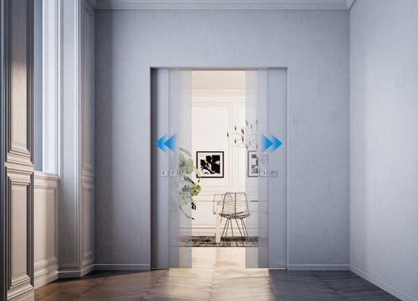Modern hallway with ECLISSE Co-ordination Kit for Syntesis Flush Double Door System, opening to a bright room with a chair, framed artwork, plant, and chandelier. Blue arrows show the direction of door movement.