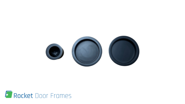 Three Rocket Door Frames - Round Flush Pull (Black) handles for pocket or sliding doors are arranged in a row on a white background, with the Rocket Door Frames logo and text in the bottom left corner.