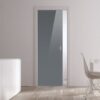 A modern interior features ECLISSE Pocket Door Systems - Classic Single Glass Doors (10mm), white walls, light wood floors, a white cupboard with vases on the left, and a dining table with white chairs by a large window.
