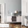 A modern living room with light walls, grey sofa, white sideboard, lamp, blue floral vase, and an open door revealing a bedroom with a sleek Rocket Door Frames - 90mm Pocket Door Kit. The Rocket Door Frames logo is in the bottom left corner.