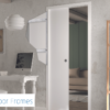 A modern home office features a Rocket Door Frames - 90mm Pocket Door Kit in white, a desk with computer, wall art, pendant lamp, and bookcase with books and plants. The Rocket Door Frames logo appears in the lower left corner.
