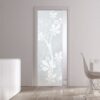 A modern room with light wood flooring features ECLISSE Pocket Door Systems Classic Single Glass Doors (10mm, plain or patterned). A white cabinet with two tall brown vases and a sleek white dining table with matching chair complete the look.