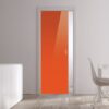 A modern interior features ECLISSE Pocket Door Systems – Classic Single Glass Doors 10mm, bright orange in colour, white walls, a cupboard with vases to the left, and a dining table with chairs to the right. Natural light highlights the stylish glass sliding doors.