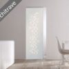 An ECLISSE Syntesis® 10mm Flush Glass Pocket Door System with a bubble circle pattern, architrave-free, is installed in a modern white dining room featuring minimalist furniture.