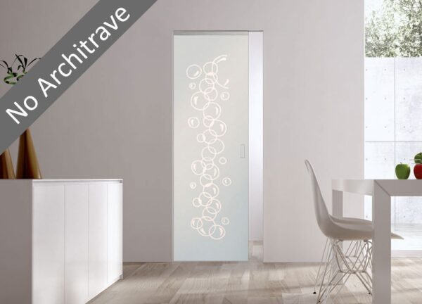 An ECLISSE Syntesis® 10mm Flush Glass Pocket Door System with a bubble circle pattern, architrave-free, is installed in a modern white dining room featuring minimalist furniture.