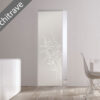 A minimalist interior features the ECLISSE Syntesis® 10mm Flush Glass Pocket Door System with floral patterns, seamlessly set into a white wall without architrave. A modern dining table and chair sit on the right as natural light fills the room.