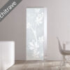 A modern interior with an ECLISSE Syntesis® 10mm Flush Glass Pocket Door System—patterned frosted glass set flush in a white wall without an architrave. Sunlight streams through a window, illuminating a dining table and chair on the right.