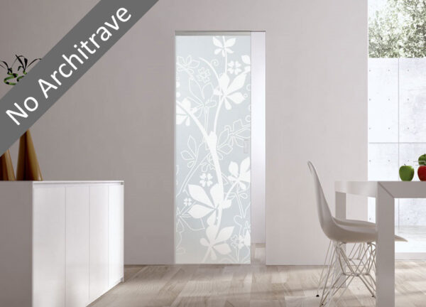 A modern interior with an ECLISSE Syntesis® 10mm Flush Glass Pocket Door System—patterned frosted glass set flush in a white wall without an architrave. Sunlight streams through a window, illuminating a dining table and chair on the right.