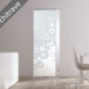 Modern minimalist space with the ECLISSE Syntesis® 10mm Flush Glass Pocket Door System (Plain or Patterned) featuring a circular design and no architrave. Shown with a white table, chair, and green/red decor. Text: No Architrave.