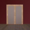 The ECLISSE Pocket Door System - Classic Double Fire-Rated is shown closed, with an orange glow and smoke seeping from its edges, set against a dark red wall and wooden floor.