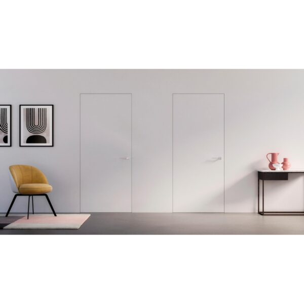 Minimalist room with ULTRA Flush Hinged Rocket Door Frames, a yellow chair on a pink rug, two abstract black-and-white wall prints, and a black console table decorated with pink and white accents.