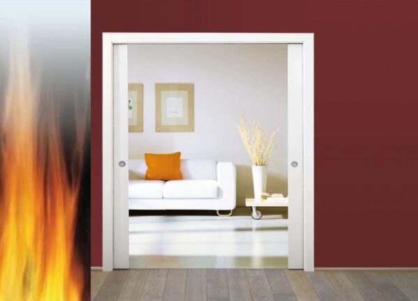 A modern living room with a white sofa and orange cushion is visible through open ECLISSE Pocket Door System - Classic Double Fire-Rated doors. Large flames rise nearby, their intensity contrasting with the calm interior.
