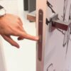 A person uses a fingerprint scanner built into the handle, showcasing biometric access on the sleek ECLISSE Door system - Syntesis® Hinged Single With Door.