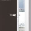 A partially open ECLISSE Door system - Syntesis® Hinged Single With Door, featuring a sleek metal handle and minimalist dark finish with white trim, reveals a view of water and buildings outside through a large window.