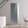 A modern, minimal room features light wood flooring, a white table and chair. The ECLISSE Syntesis® Flush (No Architrave) 10mm Glass Pocket Door System Coloured adds a seamless sliding entry to a bright space, enhancing the clean look.