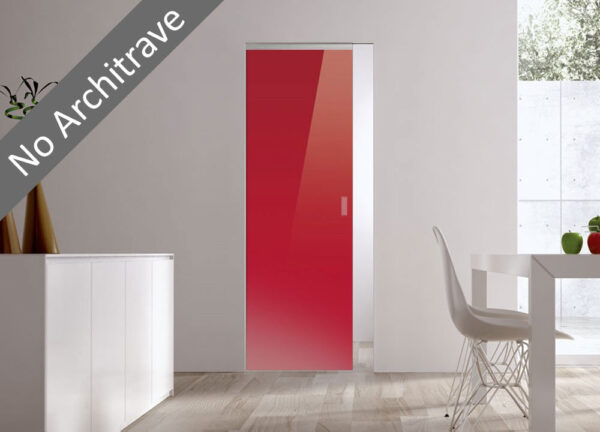 A modern, minimal room showcases the ECLISSE Syntesis® Flush (No Architrave) 10mm Glass Pocket Door System Coloured in red, set in a plain white wall. A white dining table, chair, and a plant complete the clean, understated aesthetic.