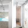Side-by-side images feature a bright indoor pool area with a ceiling hoist and a modern shower room with fold-down seat, divided by the Classic Hoist Pocket Door System. White walls throughout create a clean, open look.