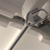 Close-up view of a ceiling-mounted Classic Hoist Pocket Door System, showing the metal track and lifting mechanism, designed for patient mobility assistance in healthcare, similar to systems used in sliding or ECLISSE pocket doors.