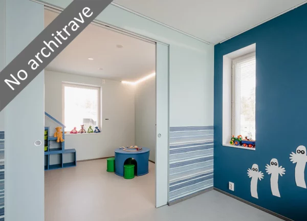 A modern playroom with blue and white walls, playful creature decals, toy shelves, and a window. Features the ECLISSE Pocket Door System - Syntesis® Double with no visible architrave. Text: No architrave.