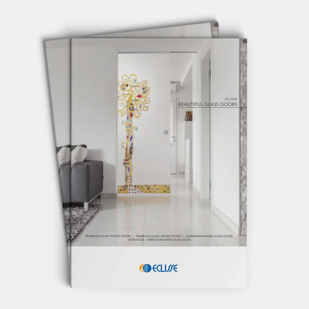 A brochure for ECLISSE displays a modern living room with a glass sliding door featuring a colourful tree design. The text reads “Beautiful Glass Doors” and highlights frameless, aluminium framed, and innovative pocket door options.