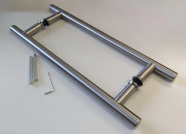 The Eclisse Pull Bar Handle - Back to Back for timber and glass doors includes two parallel stainless steel handles with black washers, an Allen key, and two screws—perfect for pocket or sliding door installation.