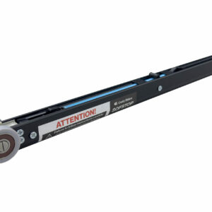 A close-up of a Cavity Sliders SofStop (Single & Double Action) black linear rail with two grey wheels on one end and an ATTENTION! warning label, appearing as a component for a sliding door or drawer system.